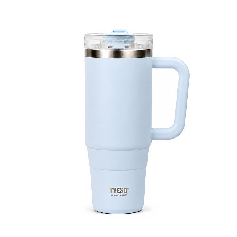 Light blue ceramic tumbler with clear lid, metal rim, and side handle