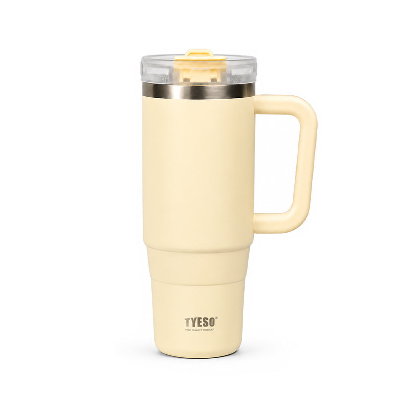 Cream yellow ceramic tumbler with clear lid, metal rim, and side handle